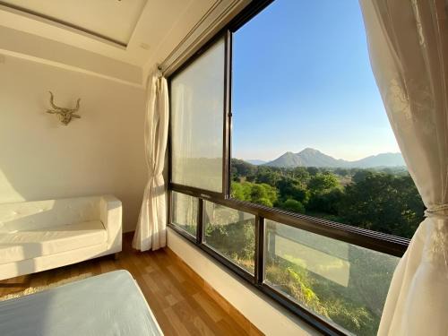 Bedla Apartment | Serene Hill view 1BHK I Pool & Gym I Udaipur
