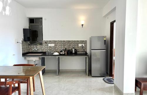 Sainagar Apartment | Boutique 1BHK Pool Retreat with Modern Amenities and Private Balcony
