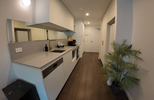 Reid Apartment | City Retreat with Rooftop Pool, Private Parking & City Views