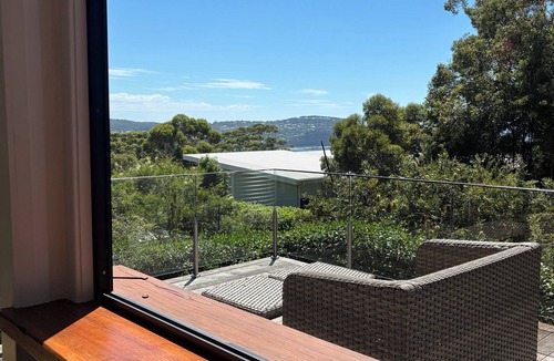 Macmasters Beach House | Cozy beach cottage with elevated north facing beach views