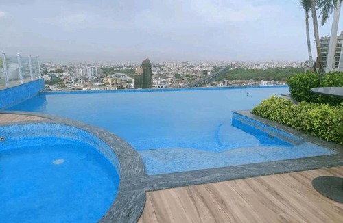 Shyam Nagar Apartment | Grand Anukampa Swimming Pool & Rooftop Bar