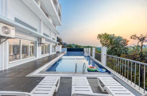 Dabolim House | MidPoint Uno Pet-friendly 1 Room Retreat with shared pool, Entertainment Area and kids area Near Dabolim Airport