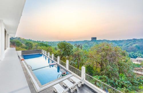 Dabolim House | MidPoint Uno Pet-friendly 1 Room Retreat with shared pool, Entertainment Area and kids area Near Dabolim Airport