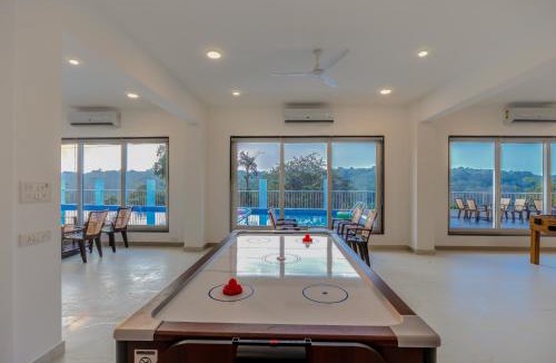 Dabolim House | MidPoint Uno Pet-friendly 1 Room Retreat with shared pool, Entertainment Area and kids area Near Dabolim Airport
