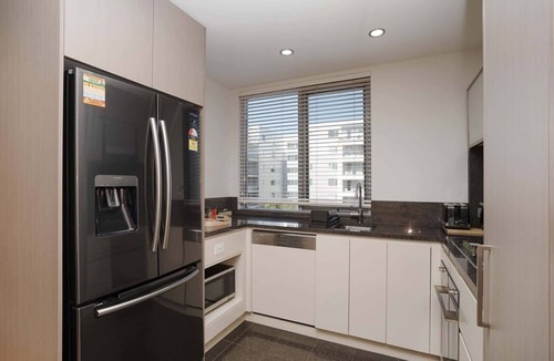 City East Apartment | Modern 1-Bed Unit with Pool Views and Balcony