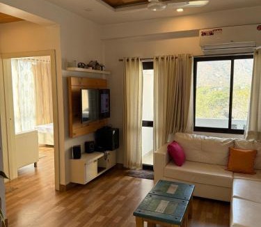 Bedla Apartment | Serene Hill view 1BHK I Pool & Gym I Udaipur