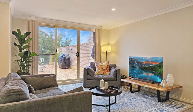 Secure Parking ~ Outdoor Pool ~ Large Balcony ~ Walk to CBD ~ Air-Con ~ WiFi