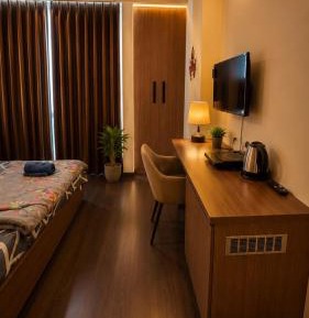 One-Bedroom Apartment with Balcony and City View
