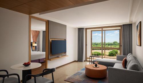 King Suite with Balcony and Pool View