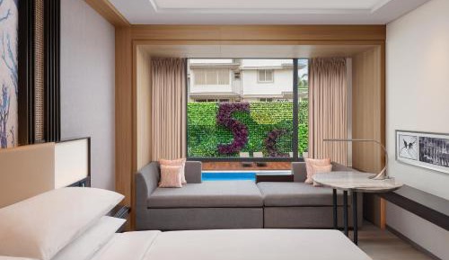 Deluxe Guest room, 1 King, Partial pool view with INR 500 Spa credit on min therapy of 60 mins per stay, Comp Bicycle available