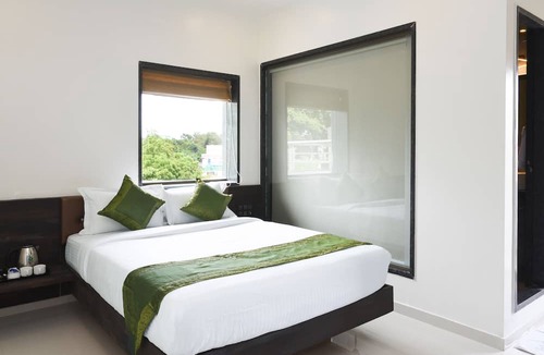 Nigdi Hotel | Treebo Malhaar Regency
