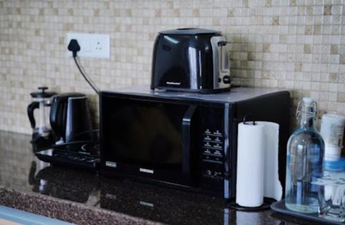 Viman Nagar Hotel | Neon - Royal Nest Aerotel with Pvt Balcony -1 km from Airport